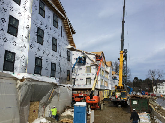 Trim being installed on a portion of the Nrth Building. Source: TMS Architects
