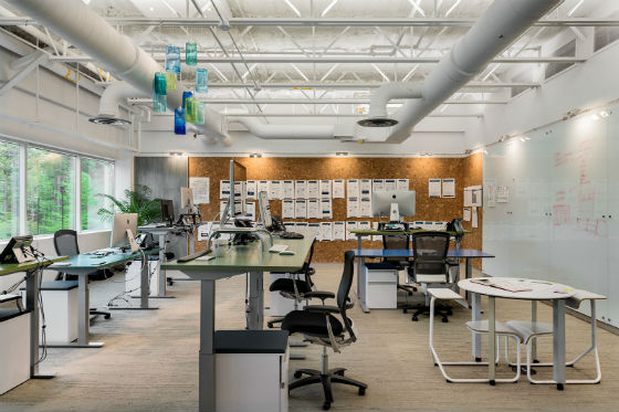 The Creative Design Team workstations include height adjustable desks which can be relocated to change the workstation. orientaiton and enhance team productivity.  Source: Rob Karosis Photography