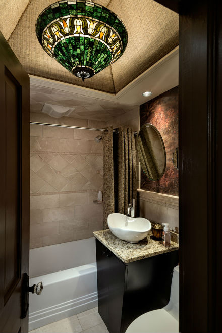 Last but certainly not least is the exquisite bathroom with its beautiful chandelier and contemporary sink. Source: Rob Karosis Photography